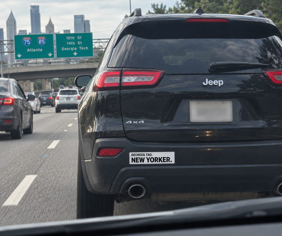 Concept rendering of a Georgia Tag, New Yorker car magnet on a car in traffic
